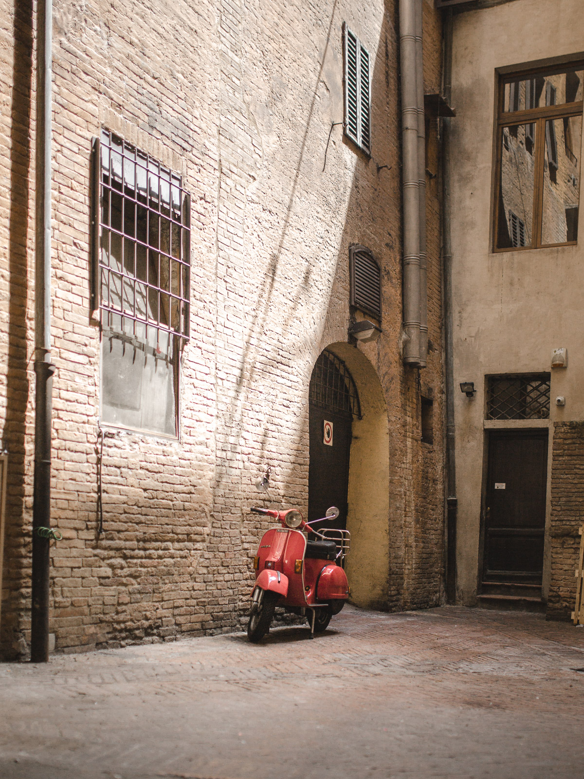 siena italy tuscany red moped
