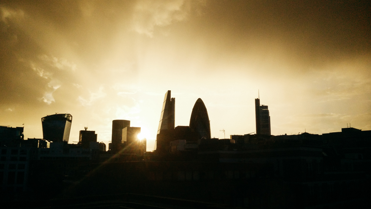 sunset over london building silhouettes